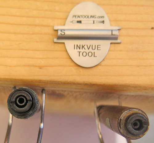 INK VUE TOOL: TOOL FOR REMOVING THREADED PLUG IN THE CENTER OF INK VUE PENS. WORKS ON BOTH SIZES. THIS TOOL HAS TWO SIDES, ONE THAT FITS A LARGE PEN AND ONE SIDE THAT FITS THE SMALLER PEN